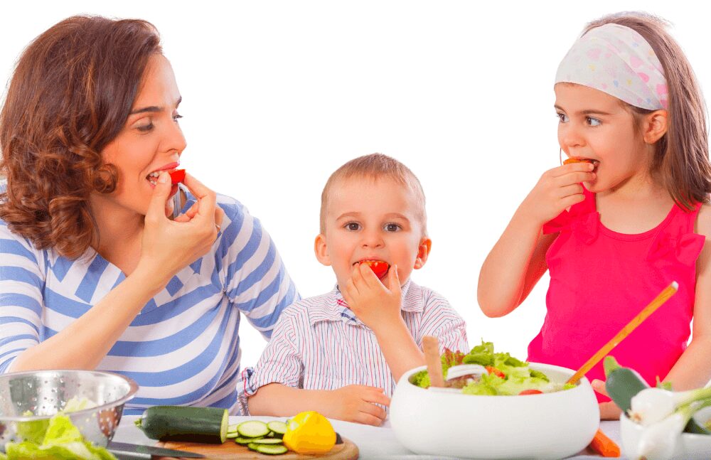 family enjoying eating vegetables