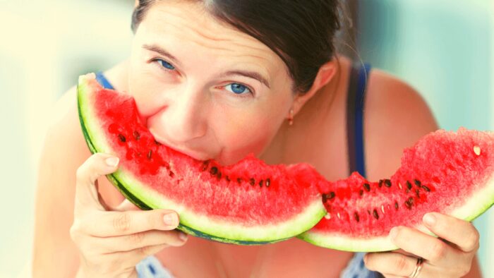 woman eating watermelon