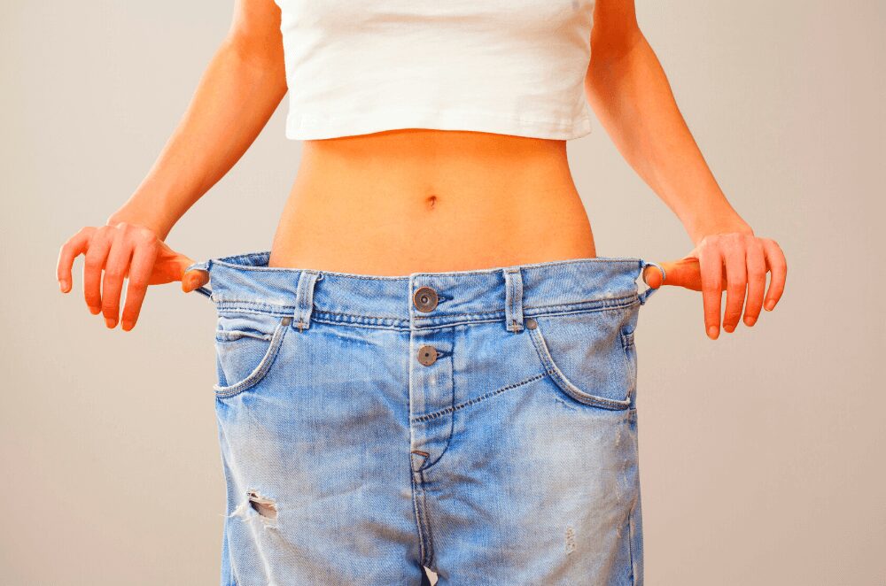 woman lost weight after a plateau in jeans