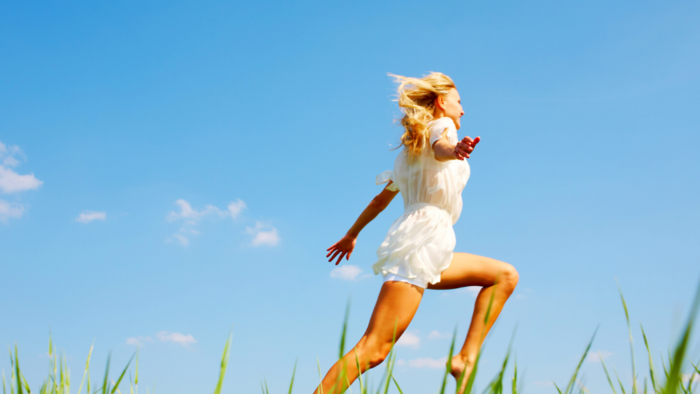 Woman waking up bursting with energy