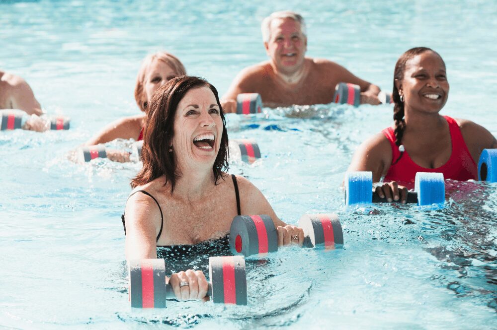group exercise pool class with woman over 50