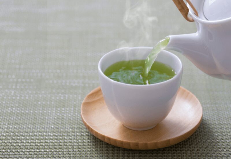 Pouring a cup of green tea