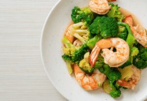 Eating shrimp is a healthy way to get more protein in your diet. The shrimp and veggies are seasoned with a simple stir-fry sauce in this dish.
