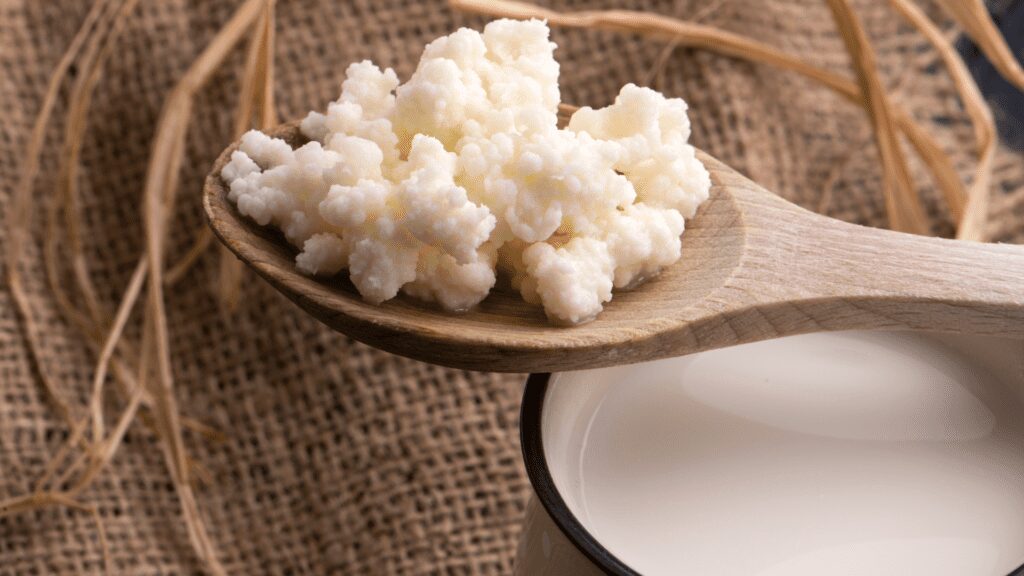Grains on a wooden spoon.