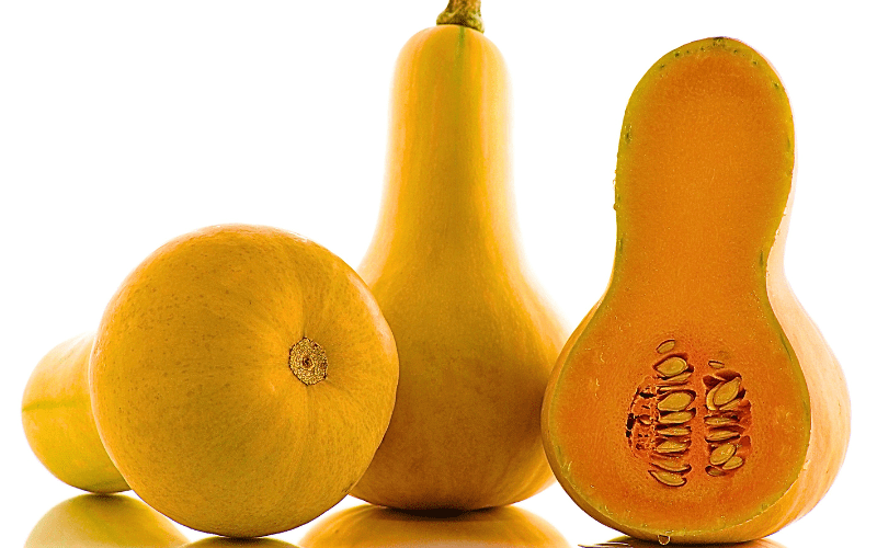 A comprehensive view of a butternut squash, including a side view, bottom view, and a close-up of a halved section revealing its intricate interior. The juxtaposition against a pristine white background underscores the vibrant colors and unique characteristics of this versatile and nutritious winter gourd.
