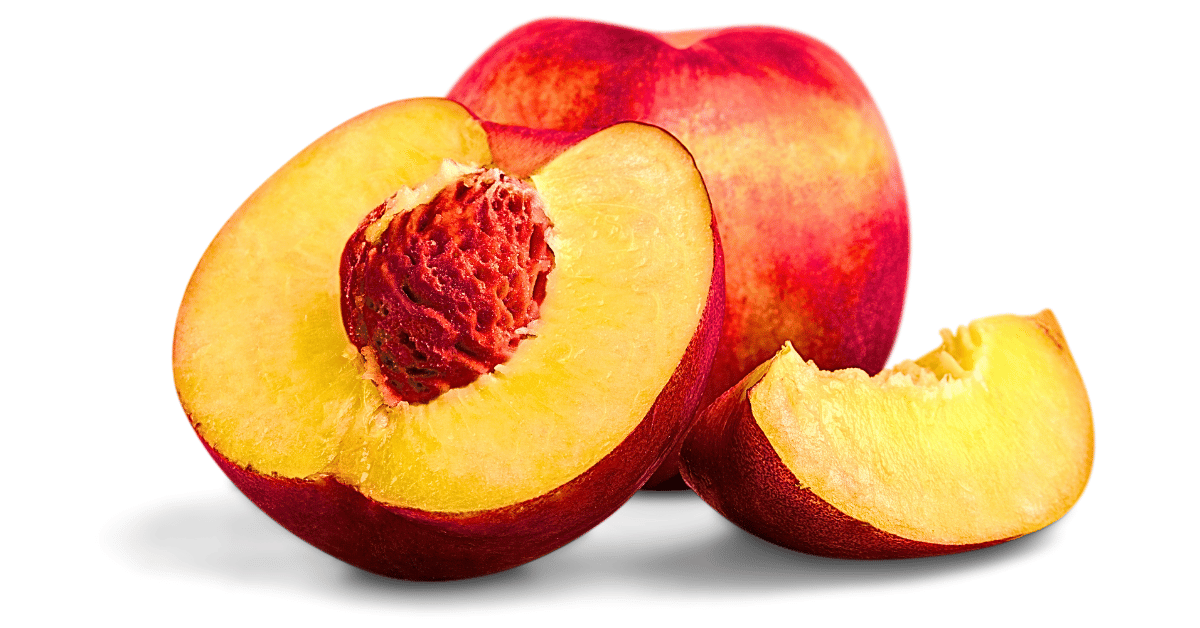 A whole ripe peach and a halved peach, revealing its pit and luscious flesh, are showcased in an up-close image set against a clean white background. 