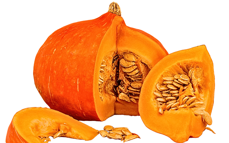 A pumpkin cut open to reveal its intricate, fibrous interior, showcasing the rich network of seeds and stringy pulp. The contrast between the vibrant orange exterior and the pale, entwined strands creates a visually captivating composition