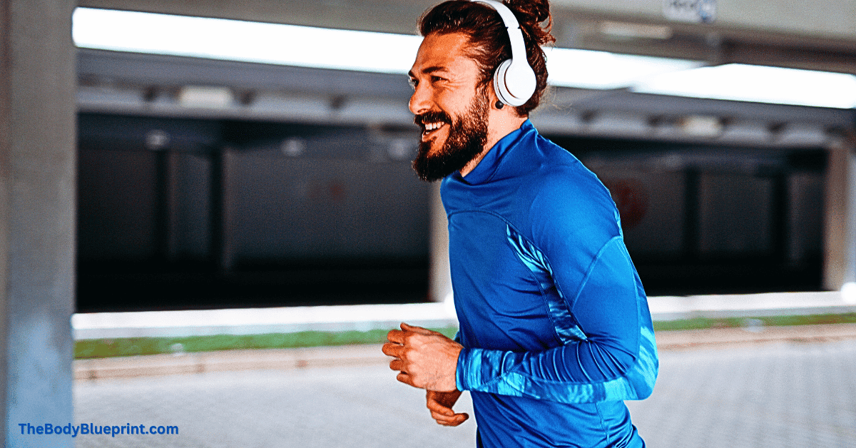 An athletic man in sportswear dynamically sprinting on a city street